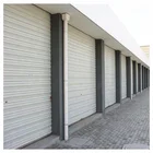 Color Steel Sheet Roller Shutter Door Frame Roll Forming Machine with seam machine