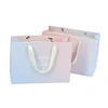 Custom CMYK matt embossed pink cardboard paper bag for gift