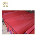 A red flat filament polyester mesh belt used in a constant non-woven fabric.