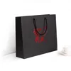 Custom wholesale logo portable price discount black shopping kraft paper bag