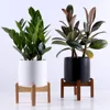 Hot sale high quality cylinder shape ceramic flower plant pots with wood stand