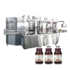 Fruit juice glass bottle twist off caps filling and capping machine