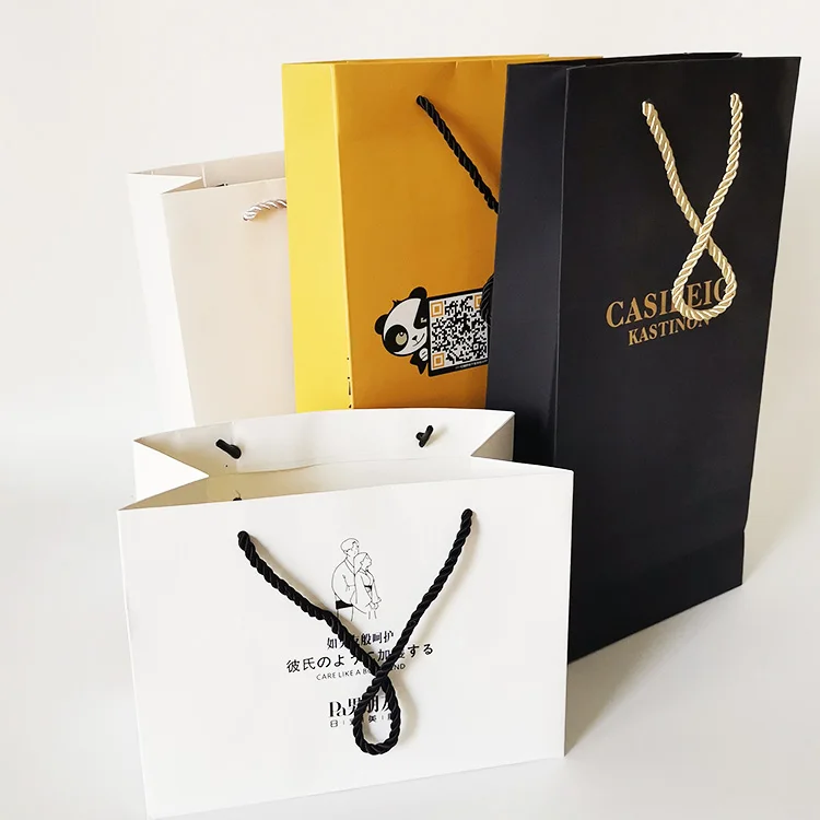 black kraft shopping paper bag with logo for clothing packaging