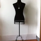 black velvet covered sitting female mannequin with metal legs