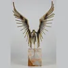 Modern decoration abstract stainless steel eagle in stone on the pedestal