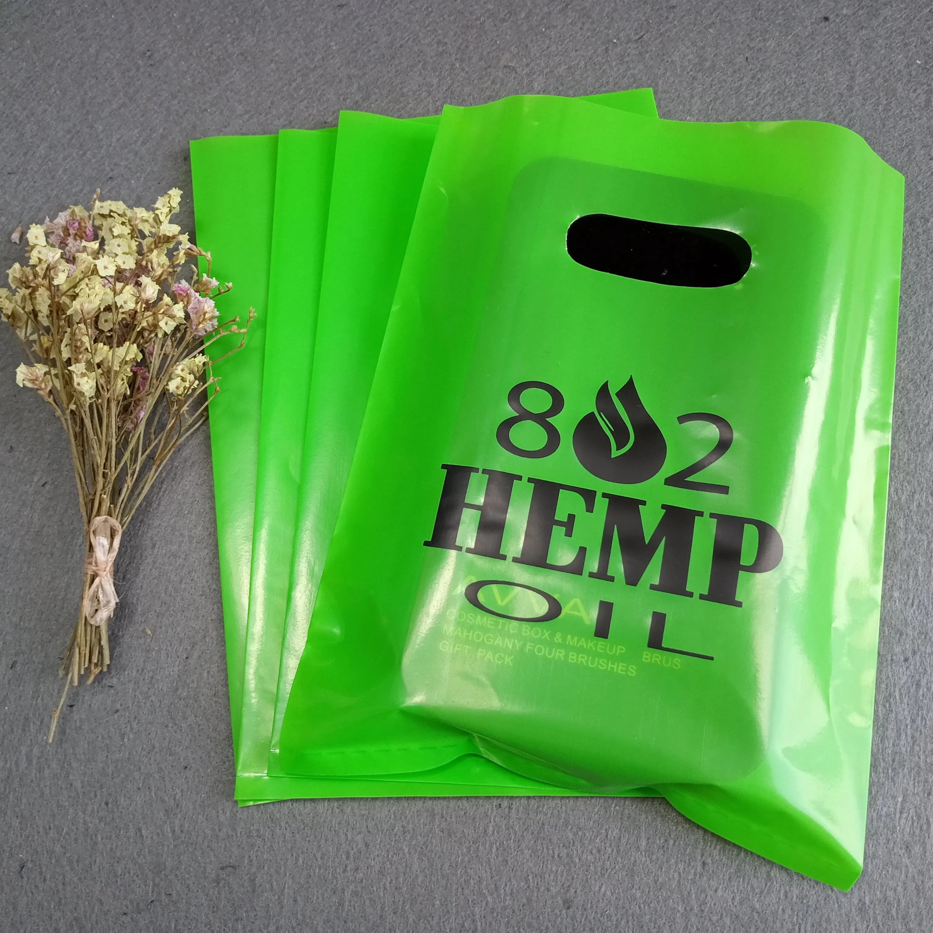 Factory Customize logo printing die cut green white pink handle bag plastic bag, Customized color
Factory Customize logo printing die cut green white pink handle bag plastic bag, Customized color