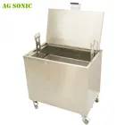 Heated soak tank to clean carbon from baking pans pizza pans with chemical