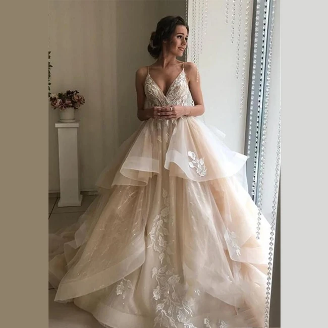 Elegant Custom Design Spaghetti Strap Lace Beaded Sequin Bridal Gowns Organza Ruffles Hemline Appliques 2020 Vestido de novia, Champagne
Elegant Custom Design Spaghetti Strap Lace Beaded Sequin Bridal Gowns Organza Ruffles Hemline Appliques 2020 Vestido de novia, Champagne