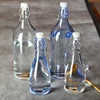 wholesale olive oil glass bottles round swing top glass bottles 16oz with custom logo