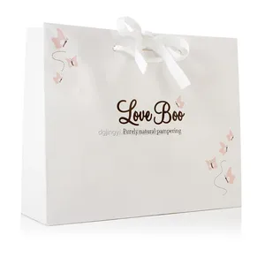 luxury white paper gift shopping bag with ribbon decoration