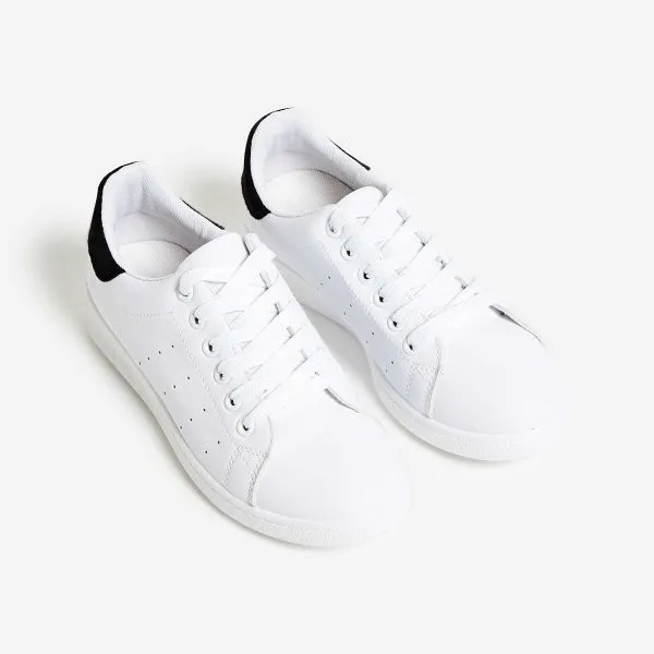 white sneakers with black heel