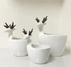 High quality Artificial reindeer design ceramic decorative flower pot for christmas decoration ceramic animal planter