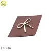 /product-detail/best-sale-brown-leather-label-with-metal-embossed-logo-jeans-pu-leather-patch-60697527835.html