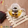 Glass Filtering Tea Maker Teapot with a Warmer and 6 Tea Cups Set