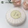 Pleated paper wrapped hotel amenity products round guest soap