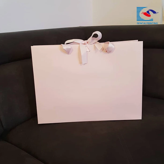 2018 hot sale custom logo elegant pink color clothing paper bag