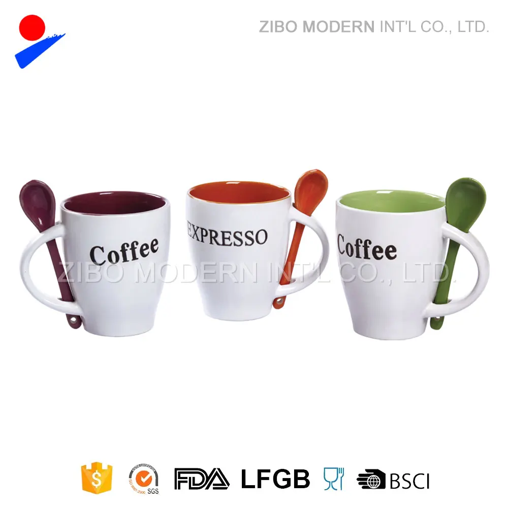 colorful inside ceramic coffee mug with spoon in handle