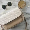 2019 new summer Dongdae door straw bag leather color matching woven bag shoulder slung female beach bag