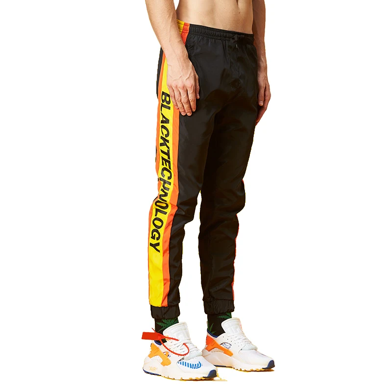 Men' new European and American loose hip hop sports couple beamed windbreaker casual pants, Black + white;black + yellow
Men' new European and American loose hip hop sports couple beamed windbreaker casual pants, Black + white;black + yellow