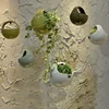/product-detail/indoor-outdoor-half-round-levitating-ceramic-succulent-plant-pots-small-hanging-plant-pot-for-cactus-60232011985.html