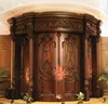 Arched carved double wood entry door