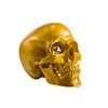 /product-detail/gold-resin-skull-with-glass-diamond-in-the-eye-1853129343.html