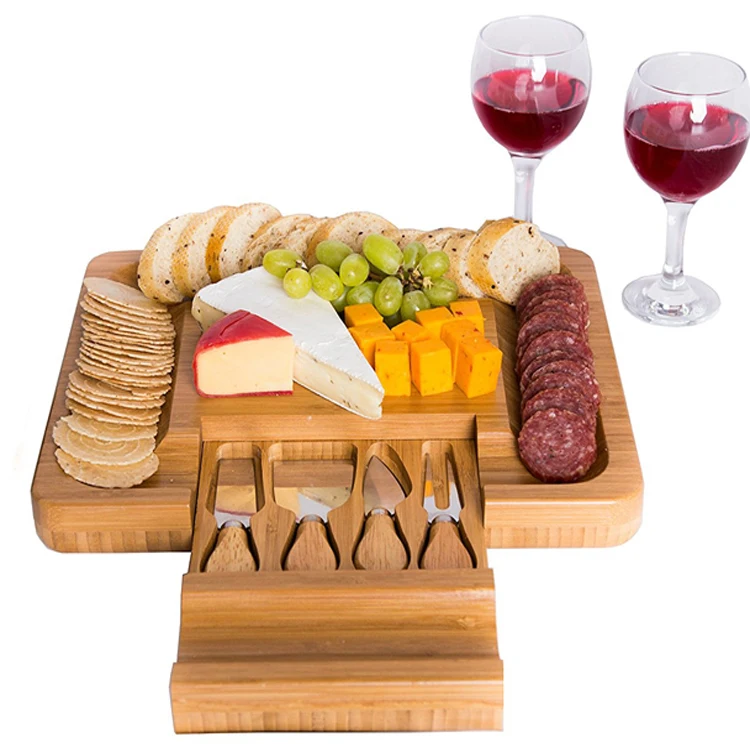 High quality wholesale bamboo cutting cheese board with 4 knives tools set, Natural bamboo color
High quality wholesale bamboo cutting cheese board with 4 knives tools set, Natural bamboo color