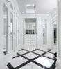 Traditional white closet with mirror doors