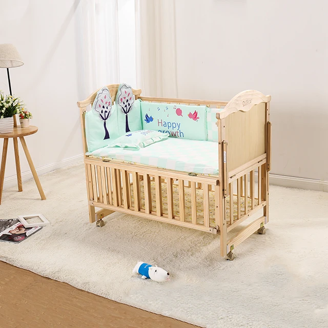 wooden bedside cot
