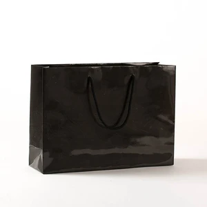 luxury boutique paper gift bags/glossy black hardboard handle