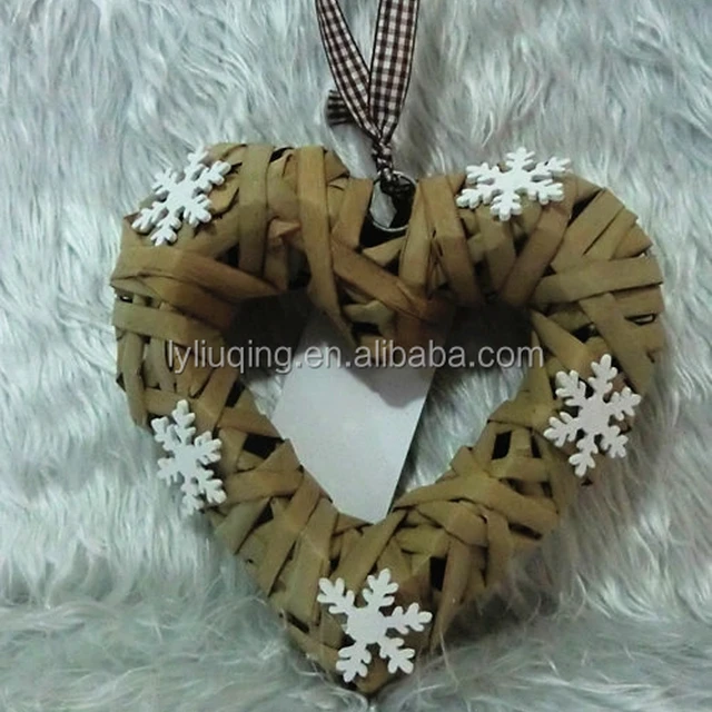 handmade christmas wicker heart shaped wreath with snowflake
