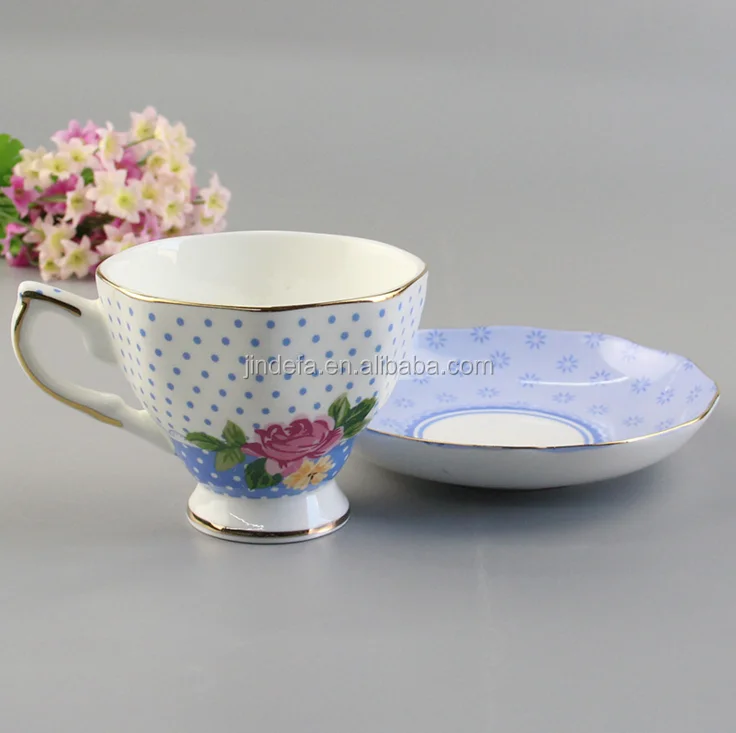 white and purple cappuccino porcelain oval coffee cup and saucer