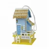 Outdoor colorful beach style wooden birdhouse with Raffia roof