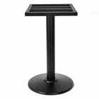Heavy low profile antique style wrought iron table leg with black powder coating finish