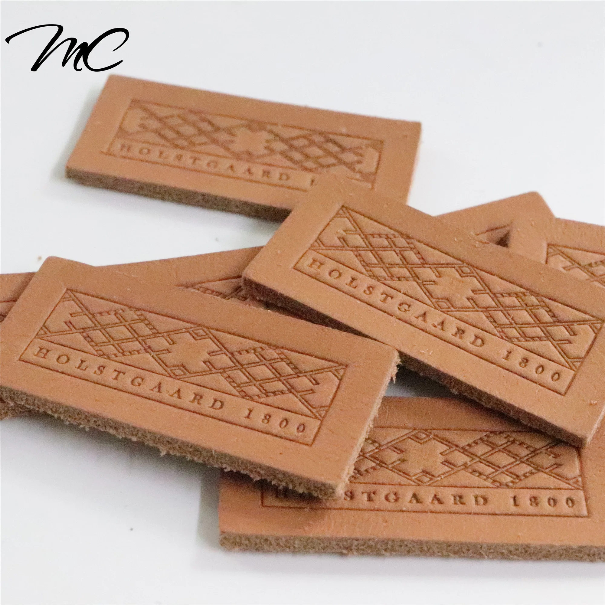 High Quality Custom Brand LOGO Debossed Genuine Leather Label Jeans Leather Patch label for clothes, Follow mc leather color chart
High Quality Custom Brand LOGO Debossed Genuine Leather Label Jeans Leather Patch label for clothes, Follow mc leather color chart