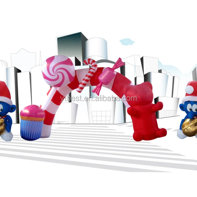 inflatable santa claus in front of christmas arch with candy