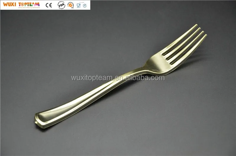 plastic fork in gold color