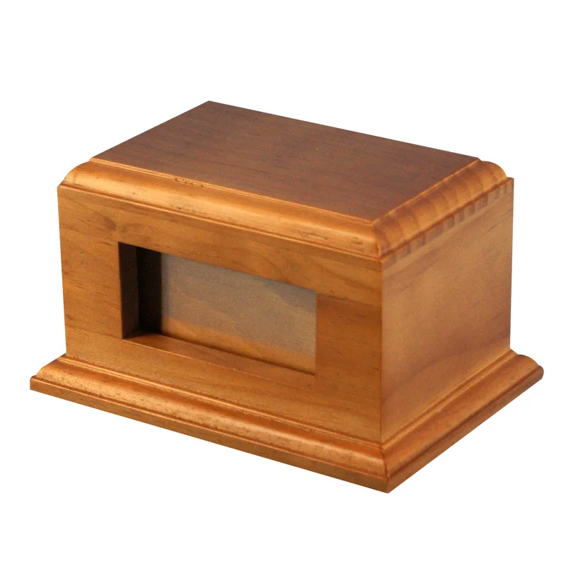 Carved wooden cremation urns for pets