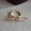 /product-detail/custom-top-sale-on-alibaba-zinc-alloy-gold-plated-angel-wing-taiwan-diamond-ring-60492414381.html