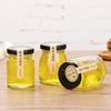 /product-detail/high-quality-mini-round-food-grade-small-30ml-honey-jar-glass-with-metal-lid-62033865878.html