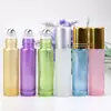 Wholesale empty essential oil perfume oil 5ml 10ml clear blue purple roll on glass bottle with steel roller ball