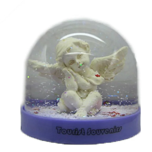 plastic resin snow globe with angel figurine insided