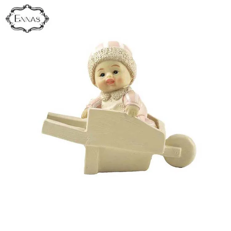 polyresin pink baby figure on barrel for birthday gift