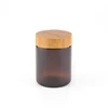/product-detail/unique-cosmetic-package-frosted-black-glass-jar-with-bamboo-lid-62047840981.html