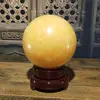 Natural energy healing yellow jade crystal balls for fengshui decoration topaz stone quartz spheres spiritual meaning