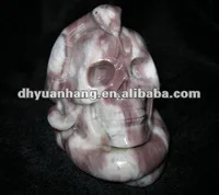 Natural rock stone skulls, meat stone skull with a snake around