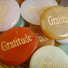 engraved semi-precious stone with word gratitude