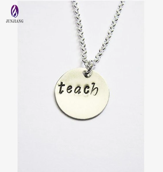 selling fashion alloy silver plated hand stamped teach pendant