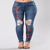 2018 hot selling African fashion women stretchy skinny big butt ripped flower embroidered trousers denim jeans pants