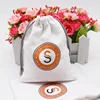 /product-detail/fashion-faux-suede-printing-logo-bag-small-velvet-pouch-jewelry-pouch-for-watch-jewelry-62193777974.html